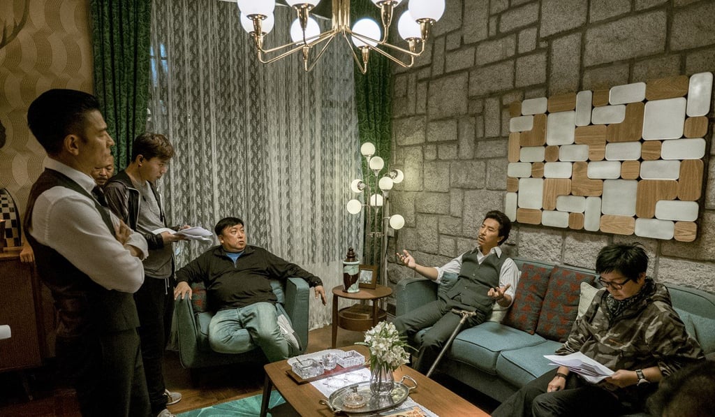 Andy Lau (left), director Wong Jing (centre) and Yen (second from right) on the set of Chasing the Dragon. Andy Lau (left), director Wong Jing (centre) and Yen (second from right) on the set of Chasing the Dragon.