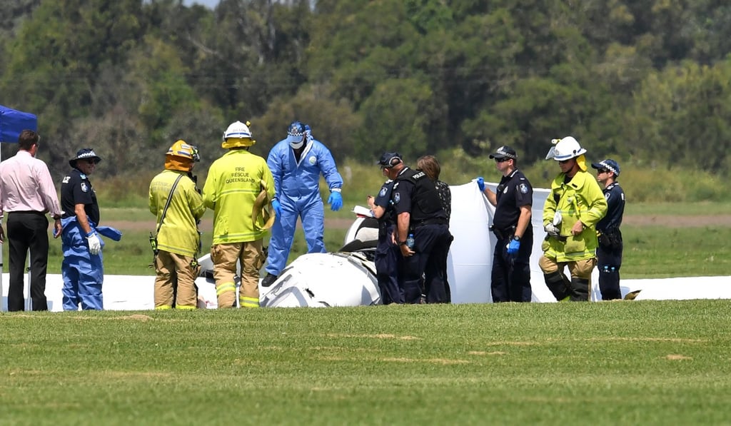 Emergency services at the scene of the light aircraft crash. Photo: EPA Emergency services at the scene of the light aircraft crash. Photo: EPA