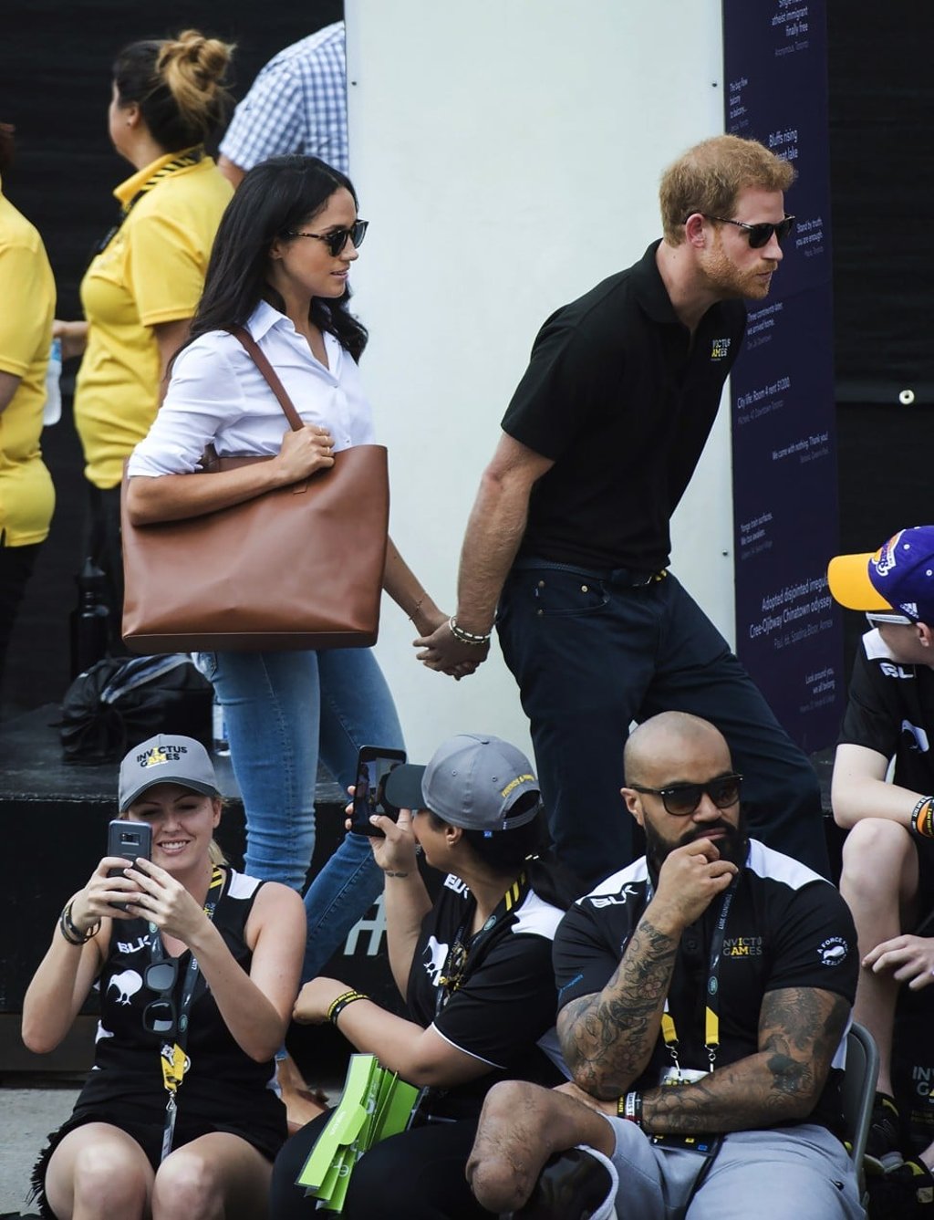Prince Harry, right, arrives with his girlfriend Meghan Markle at the wheelchair tennis competition during the Invictus Games in Toronto on Monday, Sept. 25, 2017. (Nathan Denette/The Canadian Press via AP) Prince Harry, right, arrives with his girlfriend Meghan Markle at the wheelchair tennis competition during the Invictus Games in Toronto on Monday, Sept. 25, 2017. (Nathan Denette/The Canadian Press via AP)