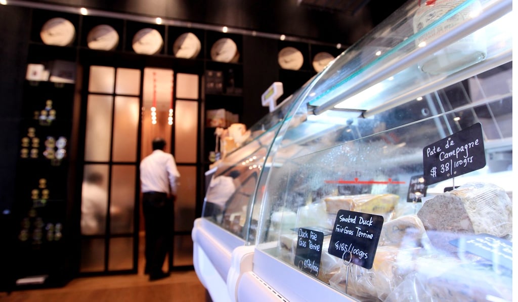 Graham enjoys the cheese at Chez Patrick Deli in Wan Chai. Photo: Jonathan Wong
