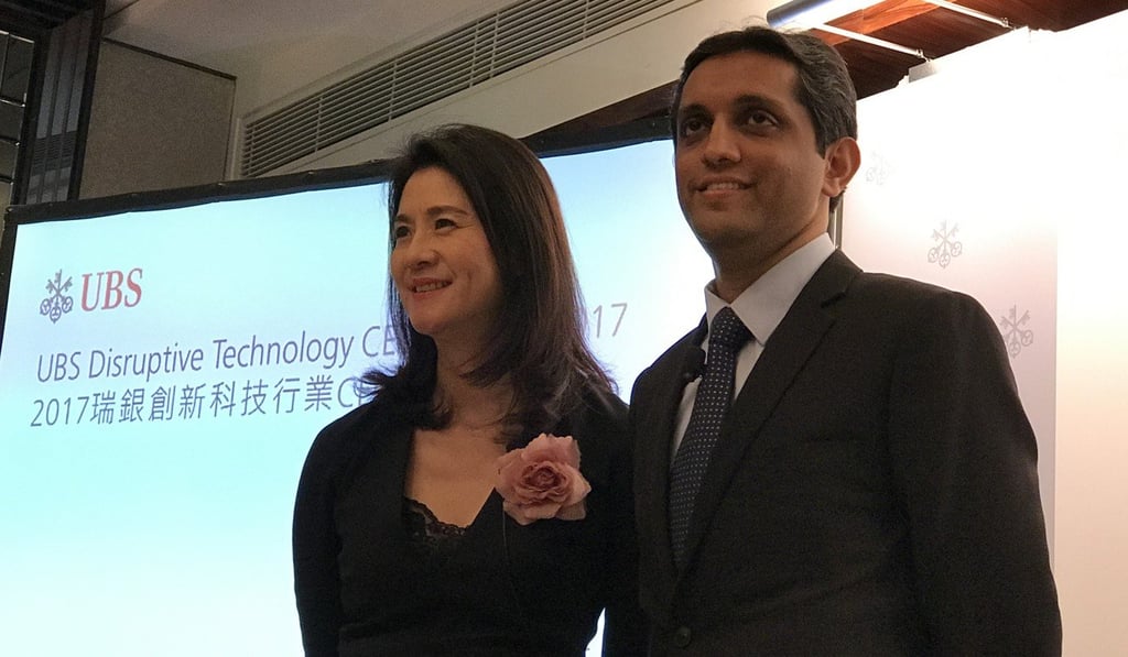 Amy Lo, the chairman and head of Greater China at UBS Wealth Management, shares the stage with equity analyst Sundeep Gantori at a press briefing on the sidelines of this year's UBS Disruptive Technology CEO Summit. Photo: Bien Perez