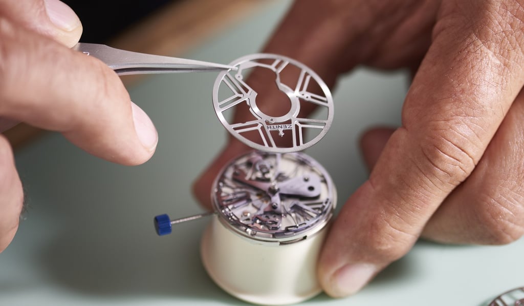 Piecing the watch components together. Piecing the watch components together.