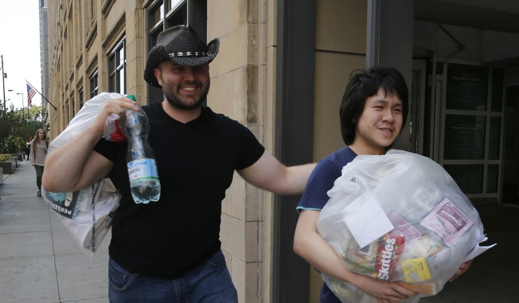 Amos Yee (right) leaves the US immigration field office with his friend Adam Lowisz on Tuesday in Chicago. YPhoto: AP Amos Yee (right) leaves the US immigration field office with his friend Adam Lowisz on Tuesday in Chicago. YPhoto: AP