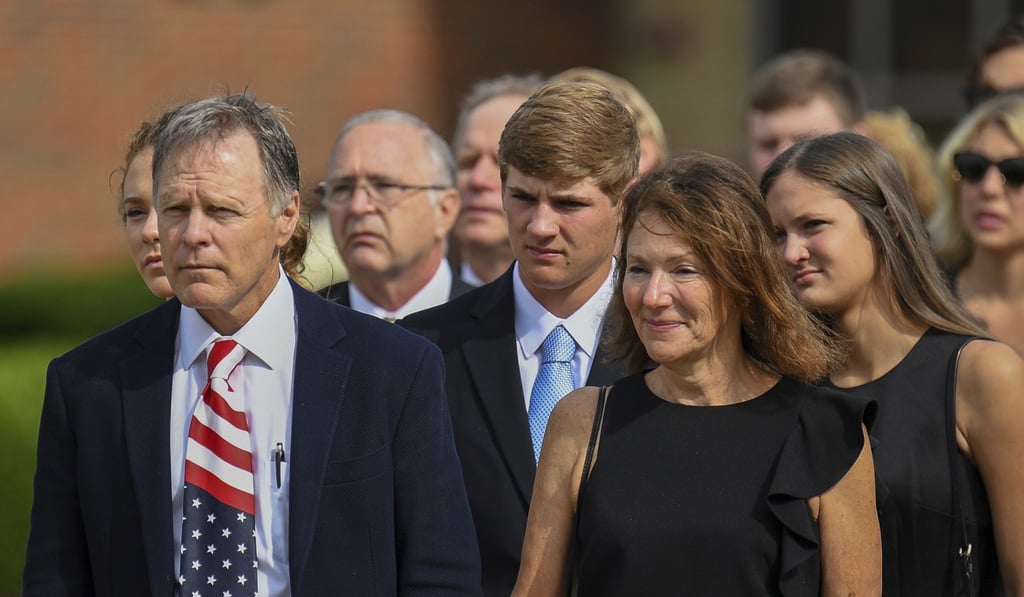 In this June 22, 2017, file photo, Fred and Cindy Warmbier watch as the casket for their son Otto is placed in a hearse after his funeral in Wyoming, Ohio. Photo: AP