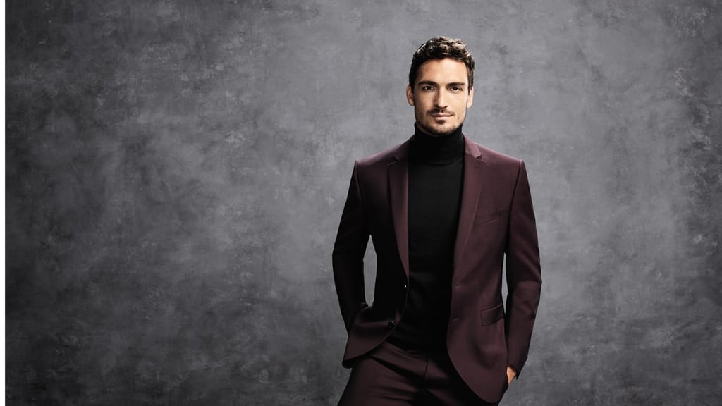 Mats Hummels in a burgundy BOSS suit. The star footballer put the new suits through their paces by performing soccer tricks in them.