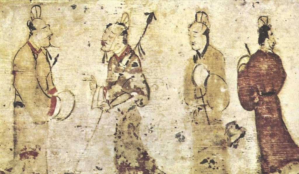 A tile from a tomb in Henan province, depicting men in conversation, from the Eastern Han dynasty (AD25-220).