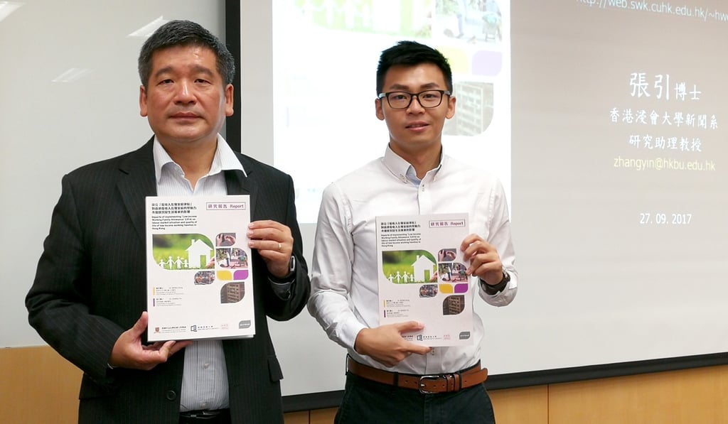 CUHK associate professor Wong Hung (left, with research assistant Nick Zhang Yin) present a report on the allowance scheme. Photo: Xinqi Su