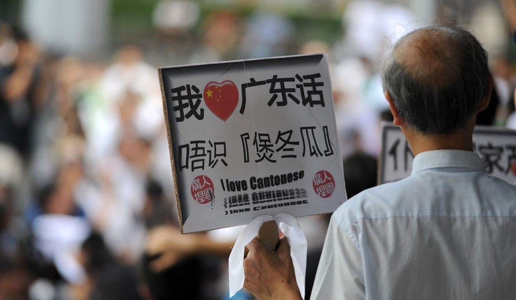 A man holds a sign professing his love for Cantonese as he attends a Hong Kong rally in 2010 against mainland China’s bid to champion Mandarin over Cantonese. Picture: AFP