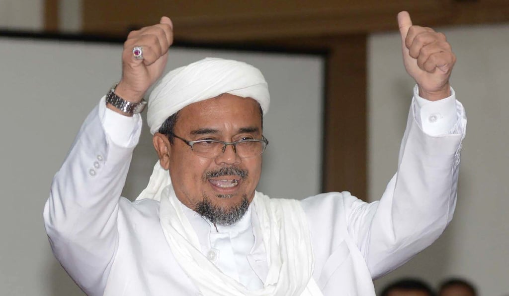 Indonesian firebrand cleric Rizieq Shihab is hiding in Saudi Arabia, wanted by Indonesian authorities for allegedly sending lewd text messages. Photo: AFP