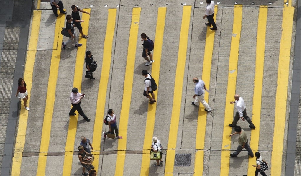 Pedestrians cross a street in Central. Hong Kong ranked sixth for global competitiveness. Photo: Nora Tam