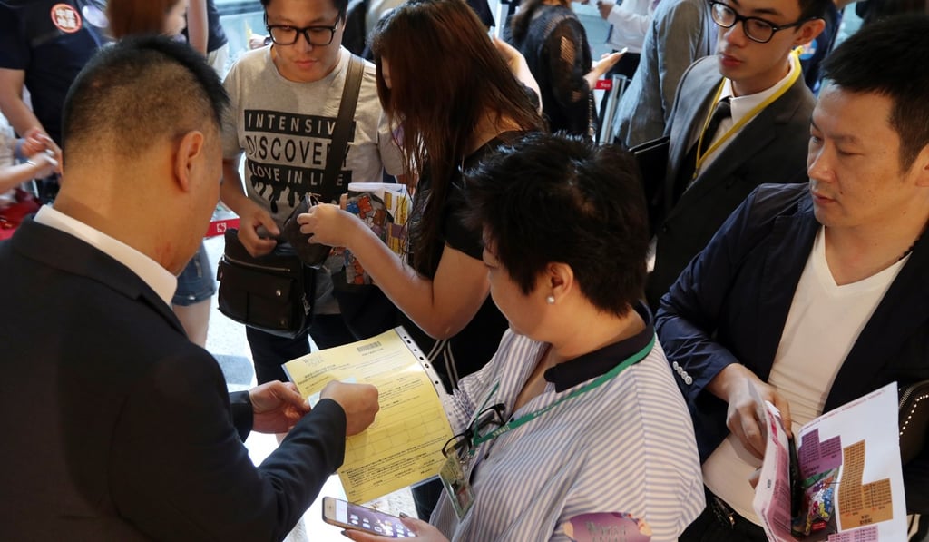 A total of 13,700 would-be buyers registered for a chance to purchase one of 403 flats. Photo: Roy Issa