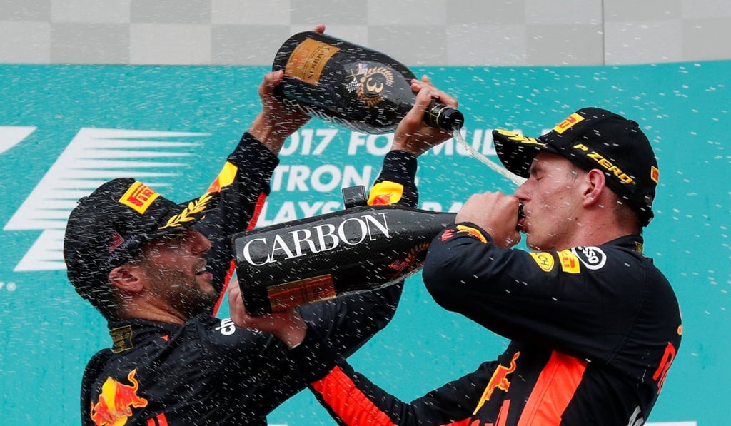 Max Verstappen celebrates with Red Bull teammate Daniel Ricciardo after winning the race. Photo: Reuters