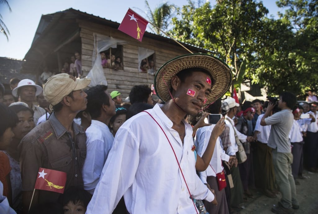 Members of the Rakhine ethnic minority queue to catch a glimpse of Suu Kyi, in Taunggok, Rakhine state, in October 2015. Picture: Ann Wang