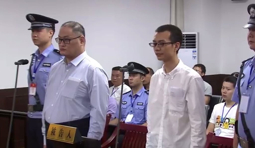 Lee Ming-che (second left) and Peng Yuhua stand trial at the Yueyang Intermediate People’s Court in Hunan province, on September 11. Photo: AFP/Yueyang Intermediate People’s Court