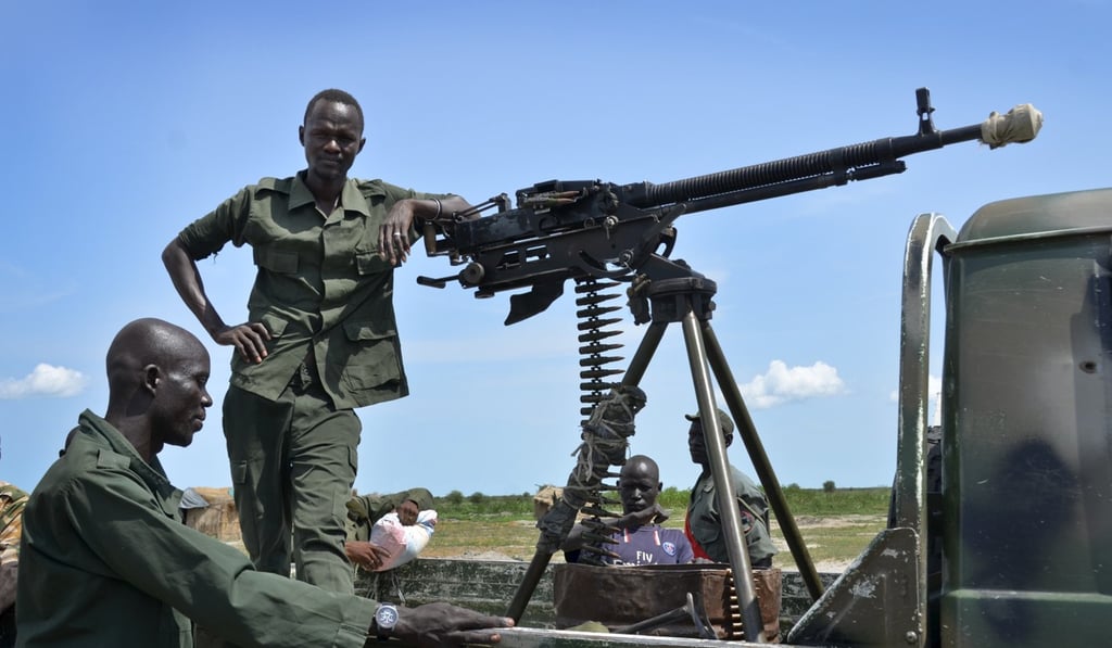 South Sudanese government soldiers stand guard by their vehicle on the front lines in the town of Kuek, northern Upper Nile state. More than four years into South Sudan's civil war, fighting between government and opposition troops shows no signs of ending. Photo: AP