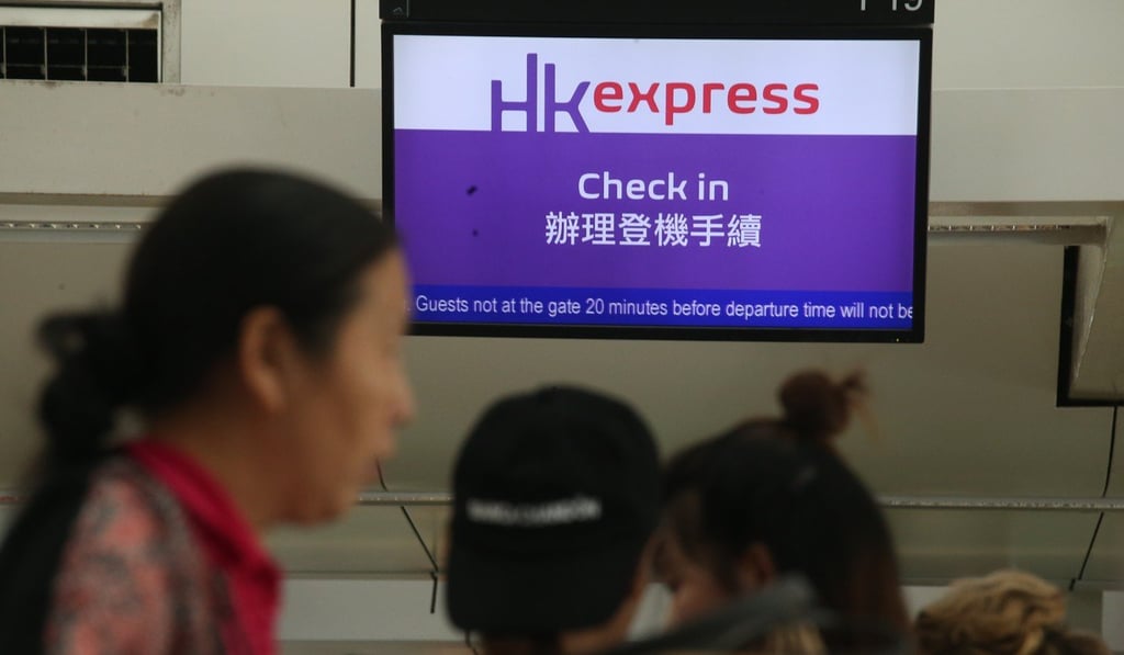 Hong Kong Express passengers queuing at the check-in counter at Hong Kong International Airport. Photo: K. Y. Cheng