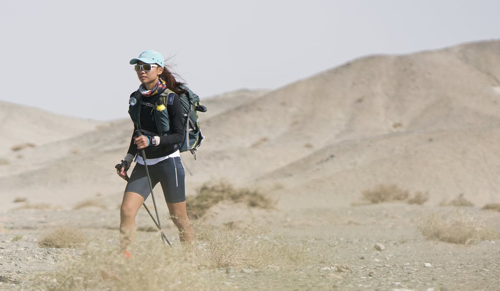 Samantha Chan battles the elements in the desert dunes. Samantha Chan battles the elements in the desert dunes.