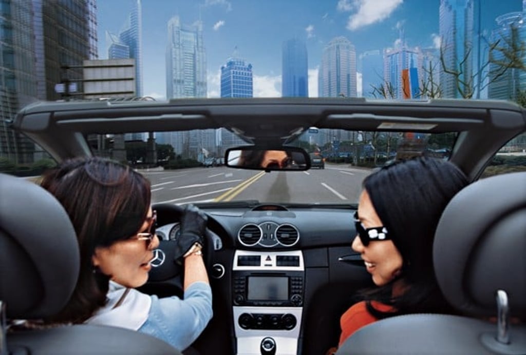 Cruising Shanghai-style in 2010, ahead of the World Expo. Young professional women Sara Si (driving) and Jennifer Cao enjoy a day out in the Pudong district in 2013.
