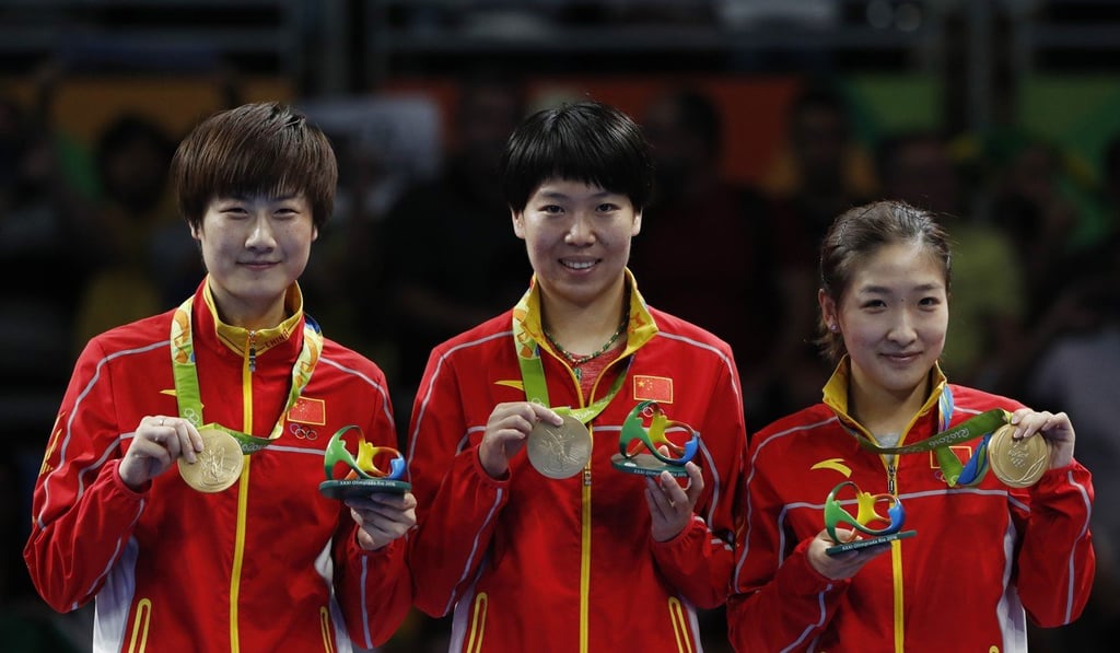 China's Ding Ning (L), Li Xiaoxia (C) and Liu Shiwen won women's team gold at the Olympics. Photo: Xinhua