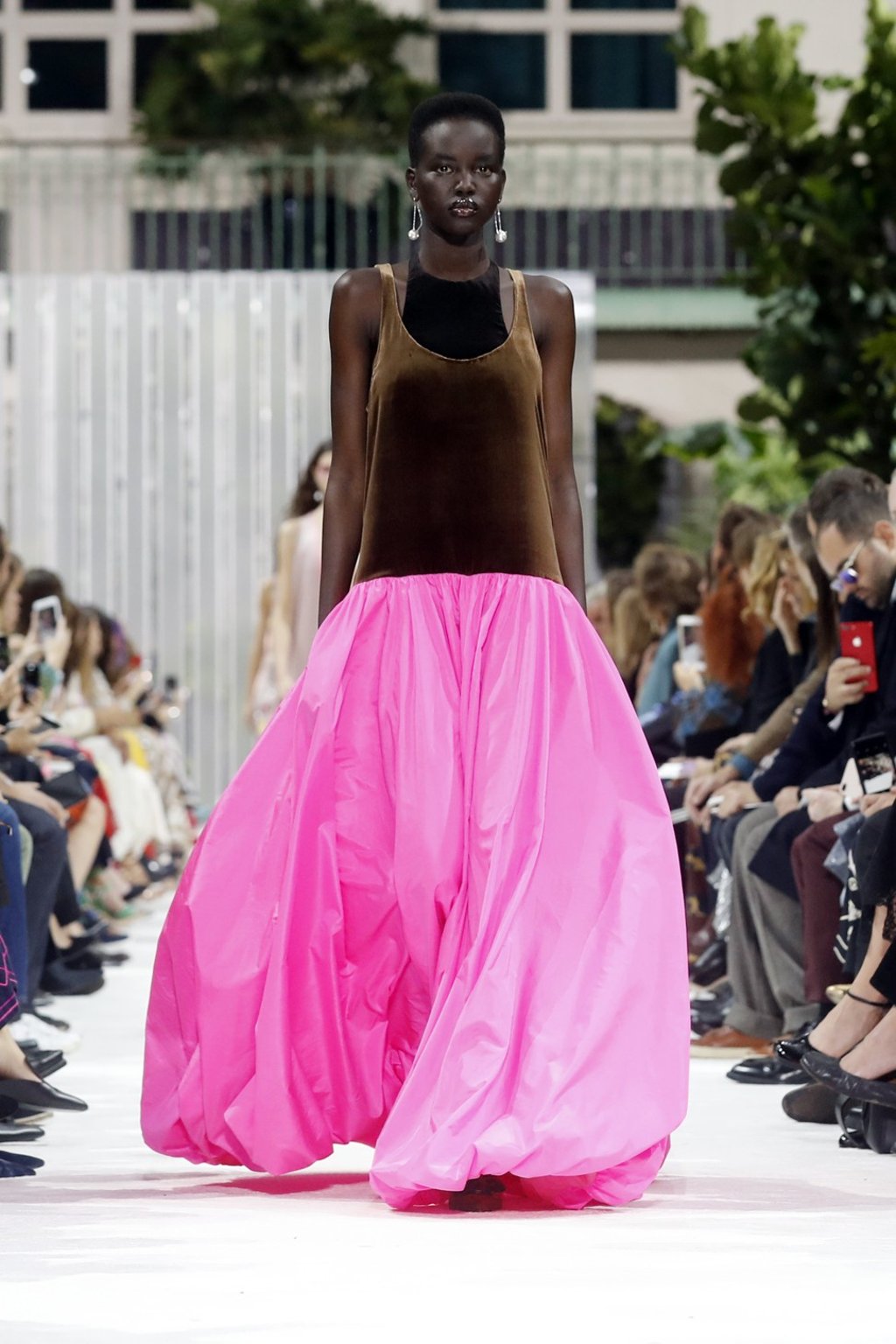 Floor-grazing gowns matched with racerback tops create a nice contrast. Photo: EPA