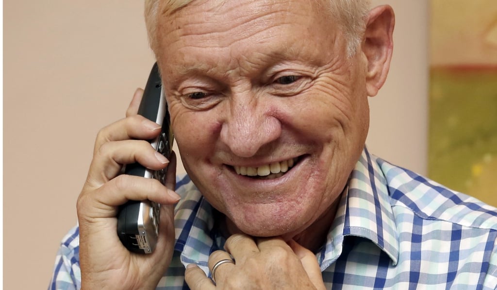 Joachim Frank, of Columbia University, takes a phone call in his New York City apartment after finding out he is one of the winners of this year's Nobel Prize for chemistry. Photo: AP