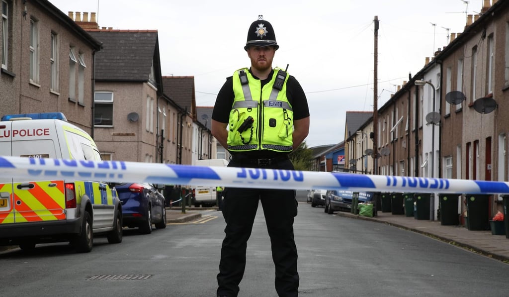 An officer stands guard at a police cordon near a house in Newport, South Wales, on September 20, during investigations into the September 15 terror attack on a London underground tube train carriage. Photo: AFP An officer stands guard at a police cordon near a house in Newport, South Wales, on September 20, during investigations into the September 15 terror attack on a London underground tube train carriage. Photo: AFP