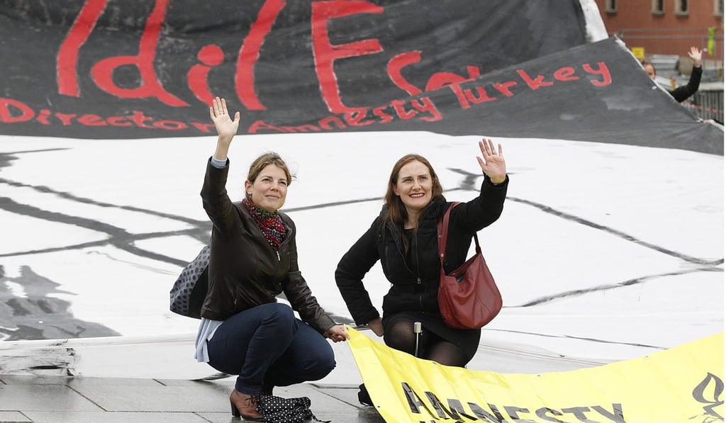 Members of Amnesty International in Poland stage a demonstration demanding the release of Idil Eser. Photo: AP Members of Amnesty International in Poland stage a demonstration demanding the release of Idil Eser. Photo: AP