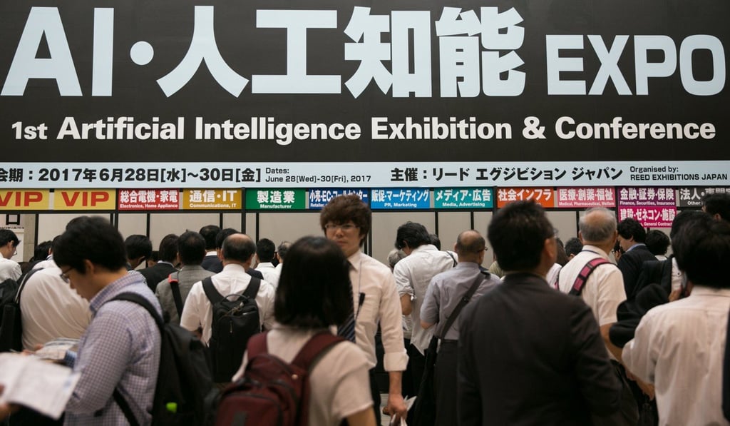 Visitors at the Artificial Intelligence Exhibition and Conference (AI Expo) in Tokyo in June. The AI Expo was Japan's first trade show related to artificial intelligence, with 110 exhibiting companies showcasing technologies and services related to AI. Photo: EPA