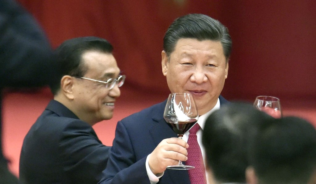 President Xi Jinping, right, and Premier Li Keqiang raise their glasses during a reception celebrating National Day in the Great Hall of the People in Beijing. Photo: Kyodo President Xi Jinping, right, and Premier Li Keqiang raise their glasses during a reception celebrating National Day in the Great Hall of the People in Beijing. Photo: Kyodo