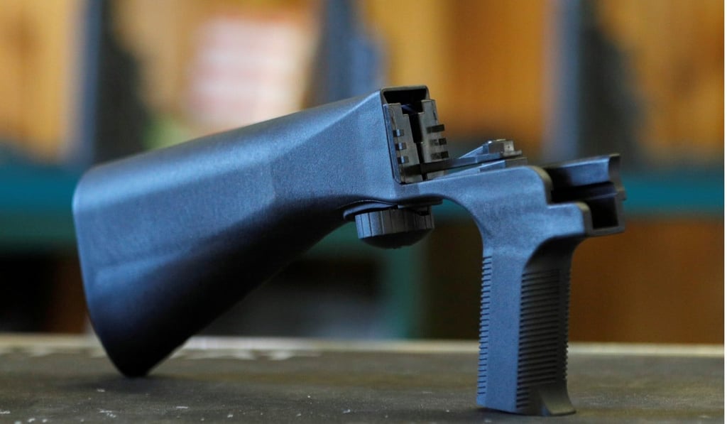 A bump stock that attaches to a semi-automatic rifle to increase the firing rate is seen at Good Guys Gun Shop in Orem, Utah. Photo: Reuters