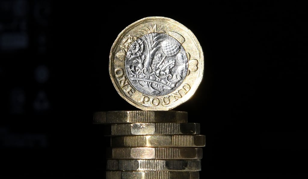 A stack of new British £1 coins. Photo: AFP A stack of new British £1 coins. Photo: AFP