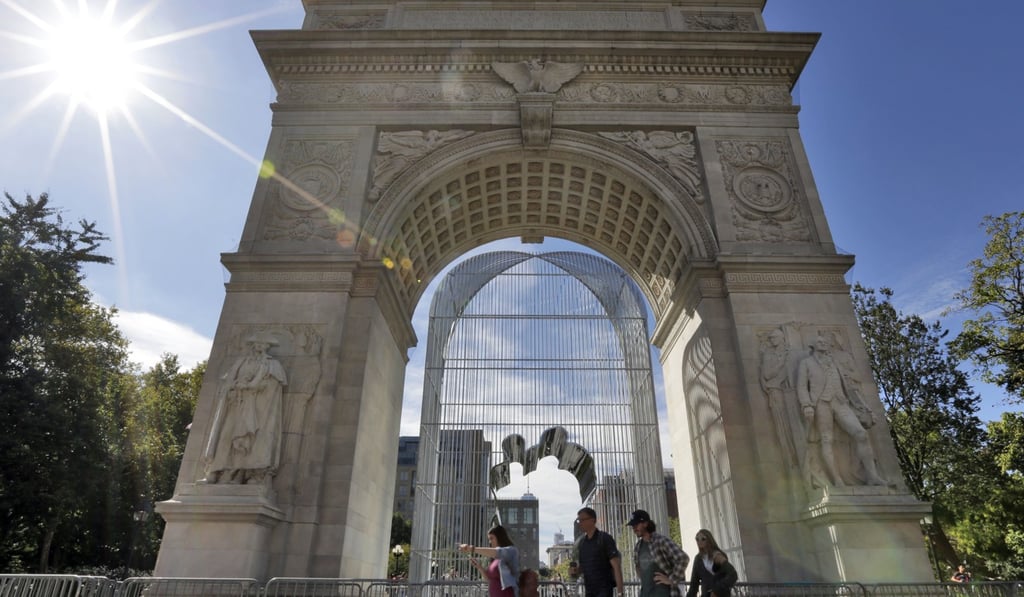 People walk past Ai Weiwei’s “Arch” inside the Washington Square Arch in New York’s Greenwich Village. Photo: AP People walk past Ai Weiwei’s “Arch” inside the Washington Square Arch in New York’s Greenwich Village. Photo: AP