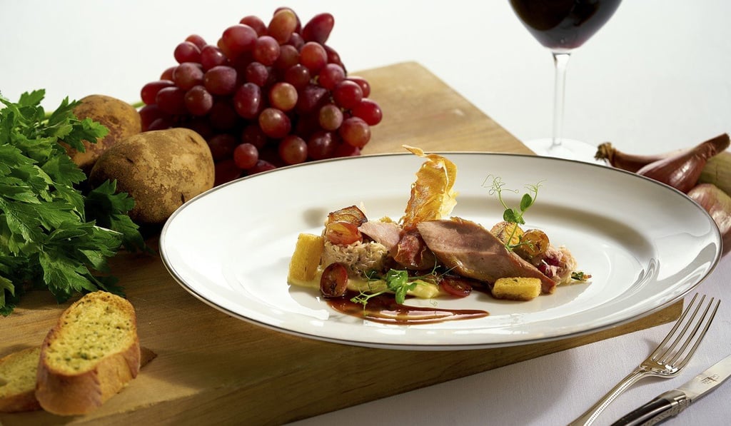 Hugo’s slow-cooked pheasant breast with champagne cabbage, mashed potatoes, grapes and bacon in burgundy sauce.