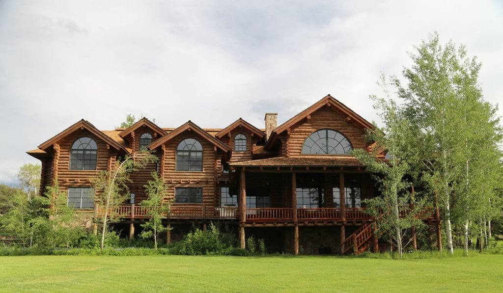 There are numerous homes on the property, including this 11,000-square-foot log lodge. Inside are nine bedrooms and nine-and-a-half baths.