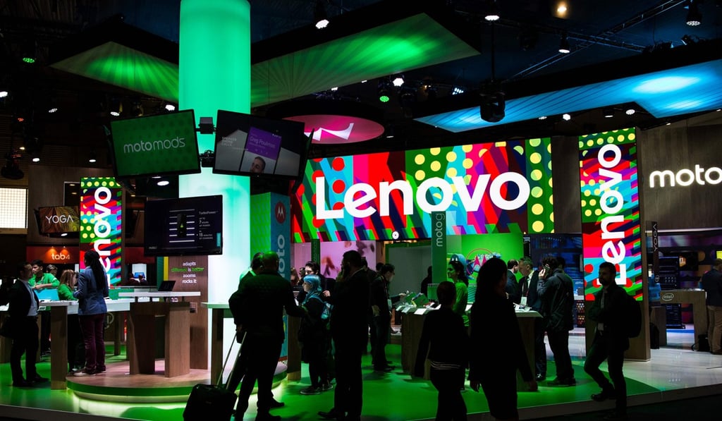 People visit the stand of Lenovo during the Mobile World Congress in March 2017. Photo: AFP