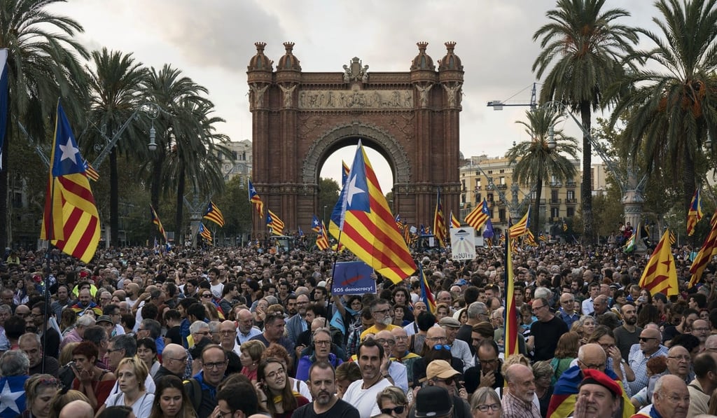 Pro-independence supporters holding Catalan flags take part in a rally near the Parliament in Barcelona, Spain, on Tuesday, October 10, 2017. Photo: AP