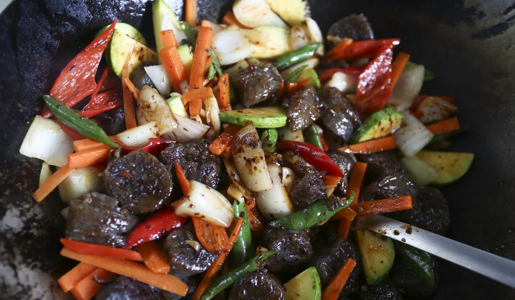 Cook, stirring often, until the ingredients are hot and lightly coated with the sauce.