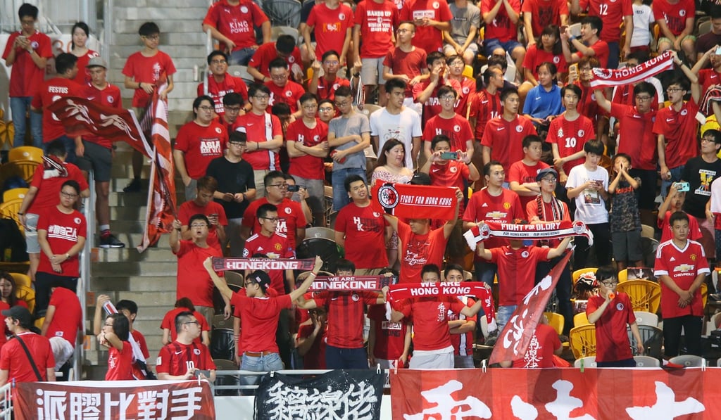 Hong Kong fans cheer on their team during the friendly against Laos at Mong Kok Stadium. Photo: David Wong