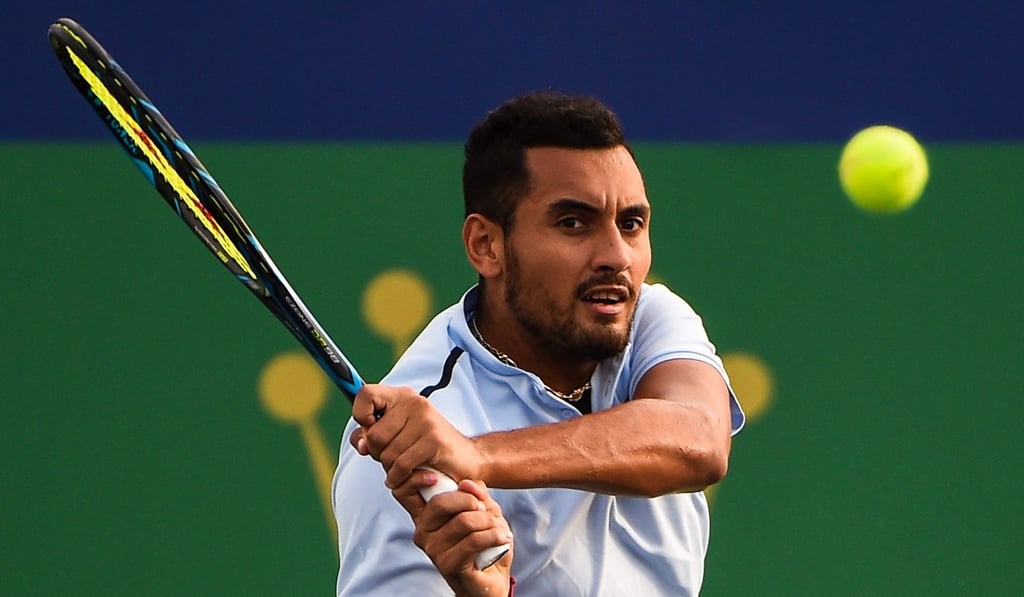 Nick Kyrgios hits a return against Steve Johnson. Photo: AFP Nick Kyrgios hits a return against Steve Johnson. Photo: AFP