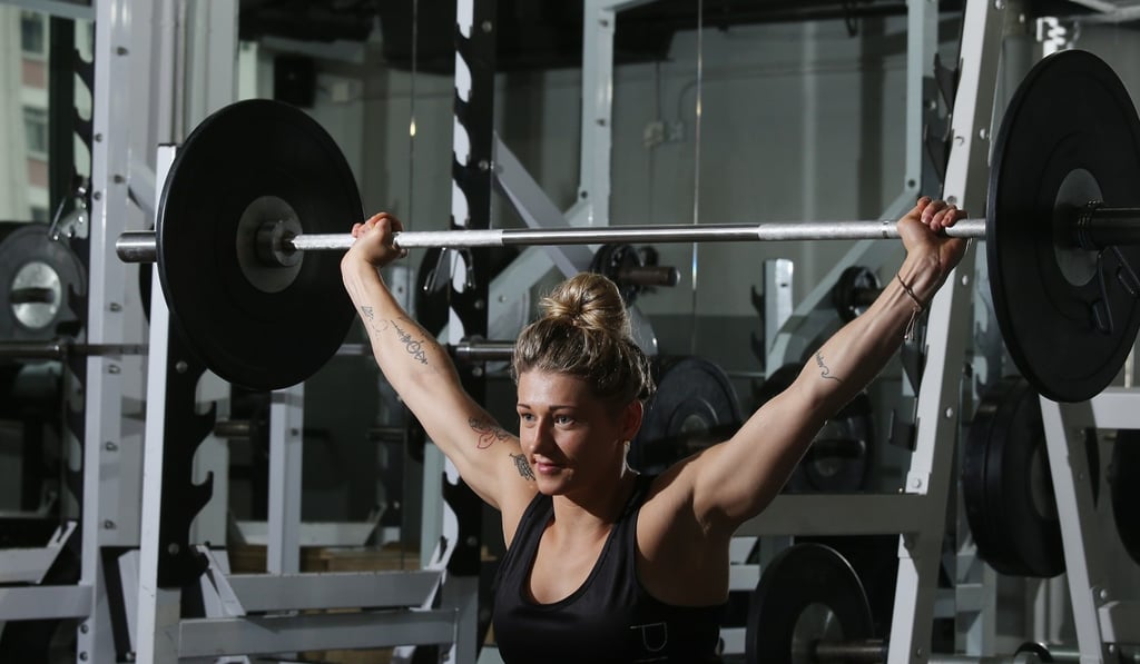 Female personal trainer Bobbie Poulton pumps some iron in Pinnacle Performance gym in Wan Chai. Photo: K.Y. Cheng