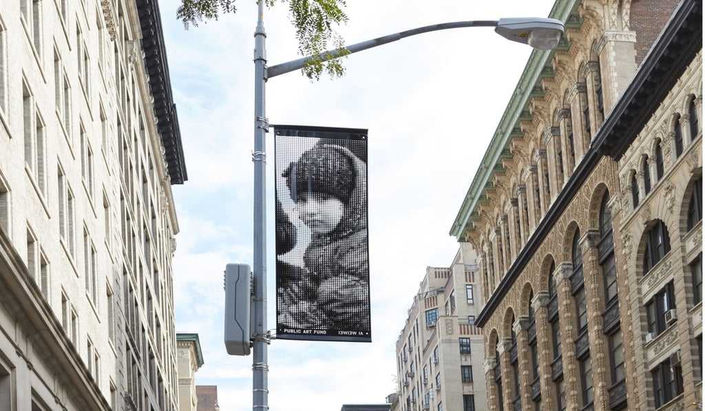 There are 200 banners of portraits hanging from street lights across the city. Photo: Handout
