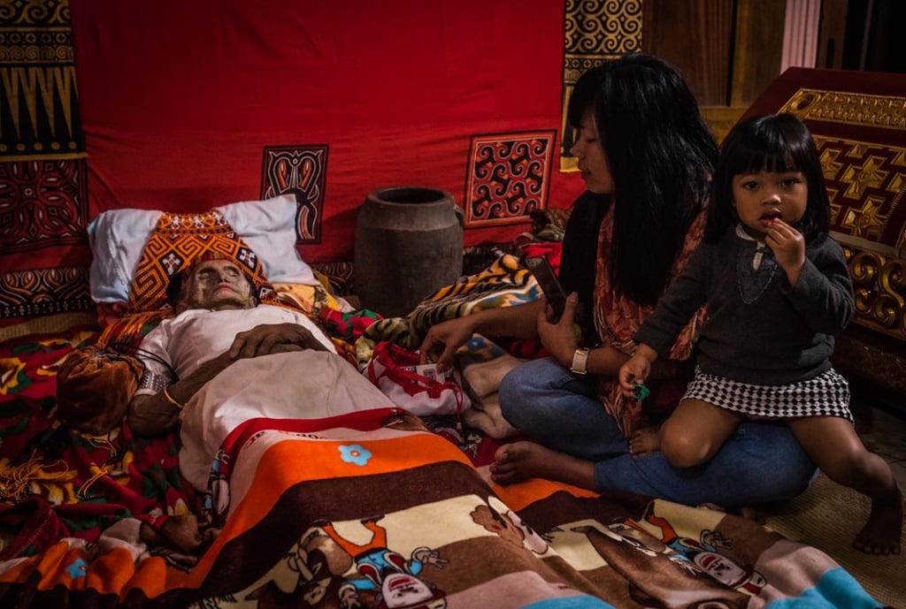 Relatives visiting Nene’ Tiku, who passed away three days earlier aged 106, will treat the deceased as if she were sick (toma kula) until the funeral.