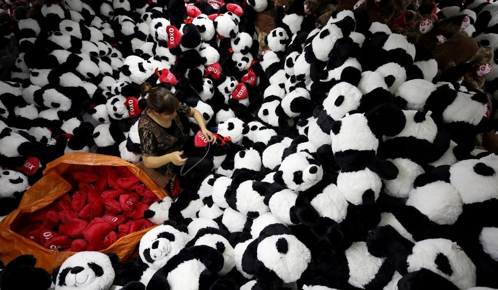 A worker processes panda soft toys for export to American and European markets at a factory in Lianyungang, Jiangsu province, on October 9. By the beginning of this century, the China narrative has been dramatically transformed, and the global balance of economic power is moving from West to East. Photo: Reuters