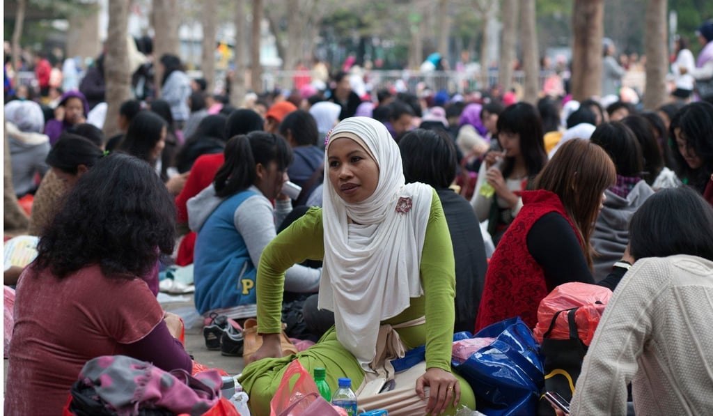 Thousands of women leave relatives behind to travel to Hong Kong to look after other families. Photo: AFP
