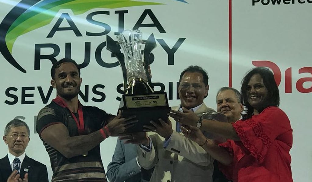 Ben Rimene accepts the cup for Hong Kong at the Sri Lanka Sevens. Ben Rimene accepts the cup for Hong Kong at the Sri Lanka Sevens.