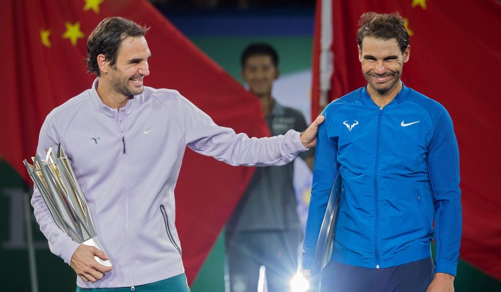 Roger Federer (left) shares a joke with his great rival Rafael Nadal. Photo: AFP