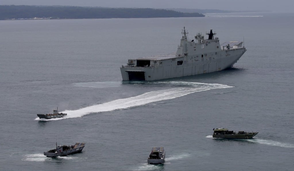 The Royal Australian Navy’s HMAS Adelaide with landing crafts carrying Philippine marines and Australian troops off Subic Bay, north of Manila. Photo: AP