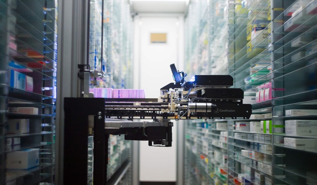 A robot retrieving drugs in the pharmacy of a major hospital. Alibaba Health is partnering with three leading mainland hospitals to launch its first artificial intelligence medical lab. Photo: Agence France-Presse