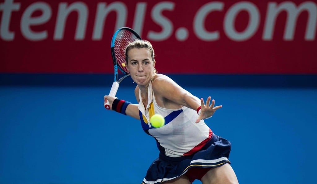 Anastasia Pavlyuchenkova hits a return against Wang Qiang. Photo: AFP