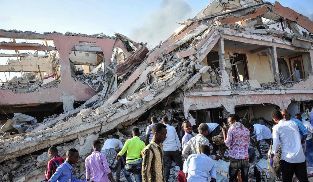 People try to rescue victims of the explosion. Photo: AFP